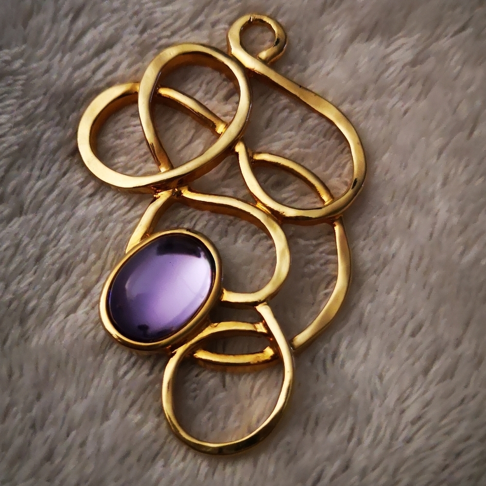 Gold tone pendant